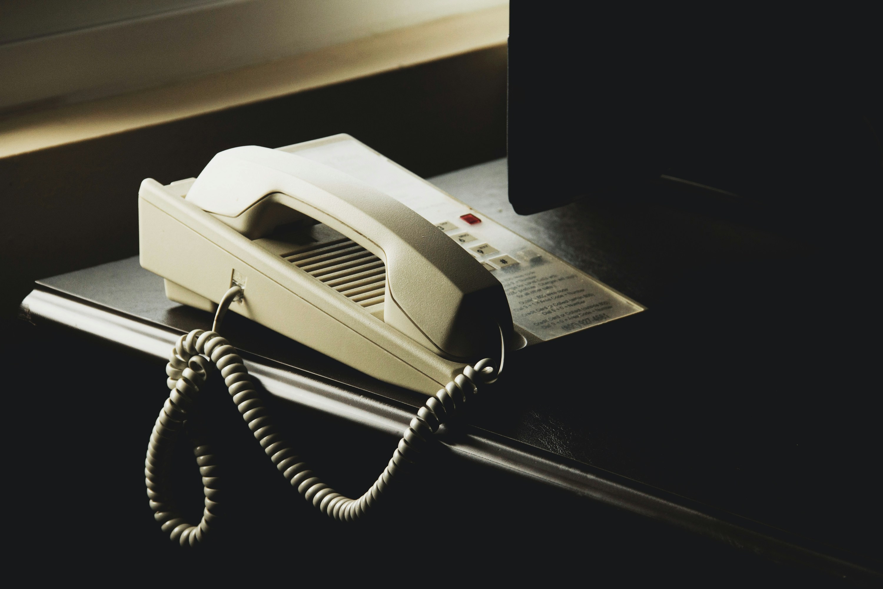 Business desk phone in a live office environment.