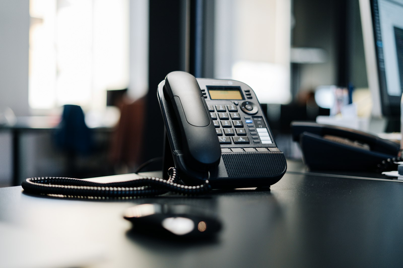 Desk phone ready for a support or service coordination call.